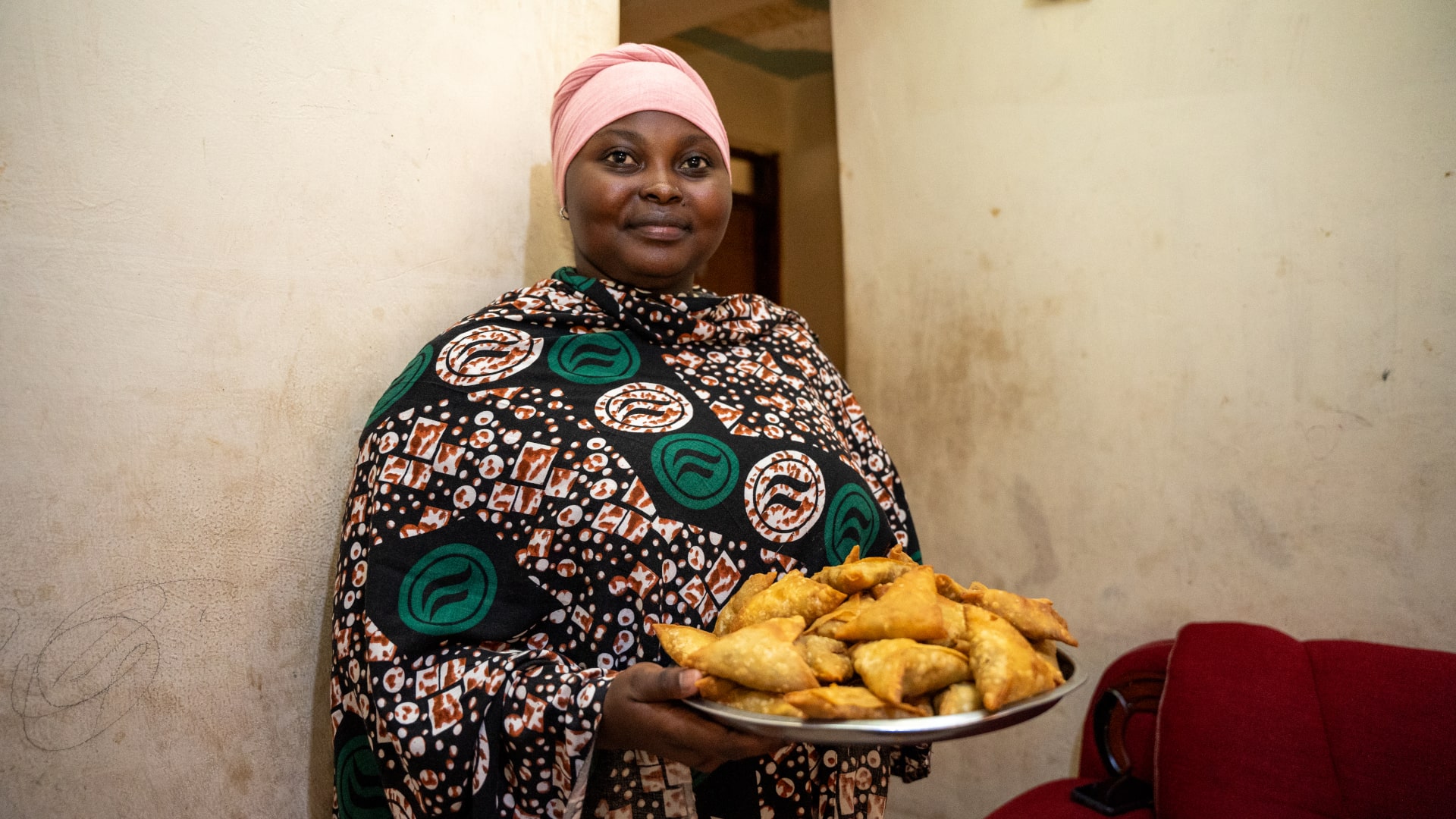 Zamzam Ibrahim prepares snacks at their home in Nairobi. Zamzam is a member of Tawakal USLA Group which is been facilitated by the ReBUiLD Program for linkages to formal financial service providers